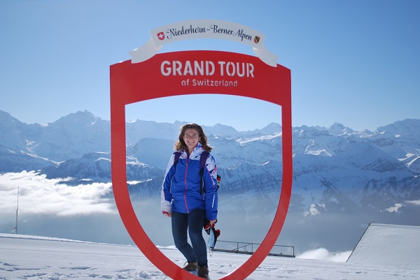 student standing under switzerland grand tour sign