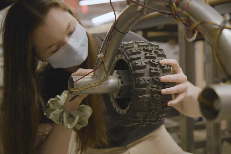 Paige Butler works on a rover