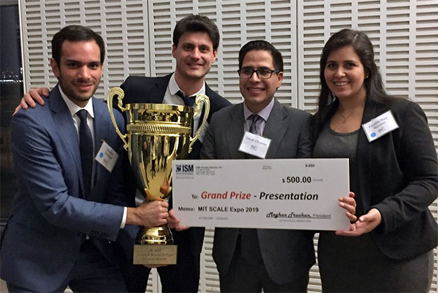 Ricardo Careaga holding cup trophy in group picture of others holding grand prize enlarged check