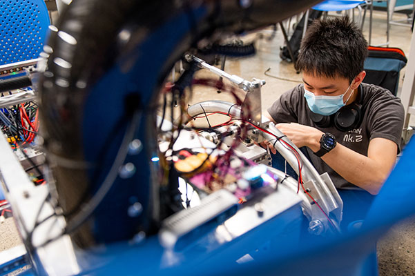 student works on NURover project
