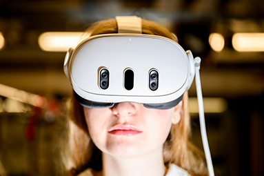 student wearing vr goggles
