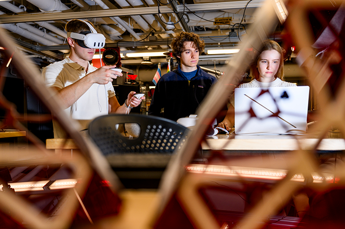 three students work on a project in the ece capstone lab