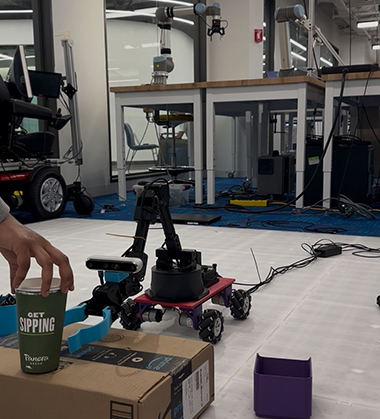 pattala's robot arm for her final semester project picking up a cup