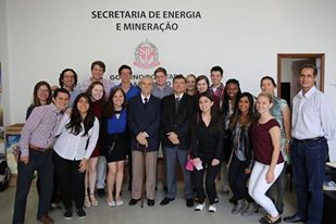 group of students in front of sign written in Brazilian.